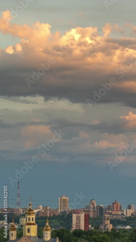 Kyiv, Ukraine - May 19, 2026: Beautiful vertical cloudscape timelapse over the city skyline buildings at golden hour, ideal for social media mobile stories.