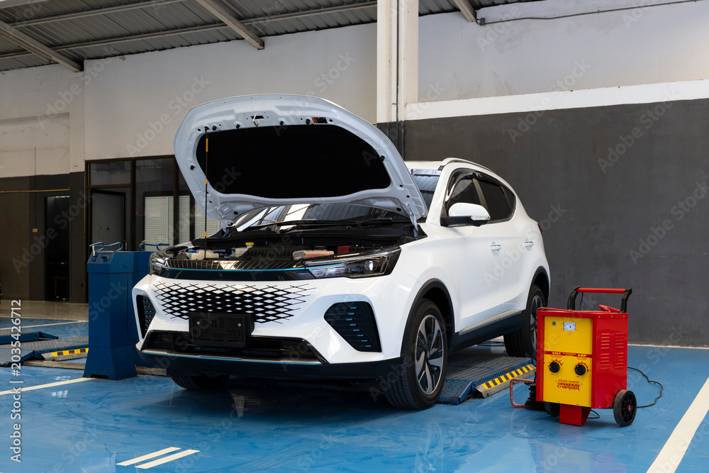 Fototapeta premium Damaged Car Under Repair in Professional Auto Service Garage