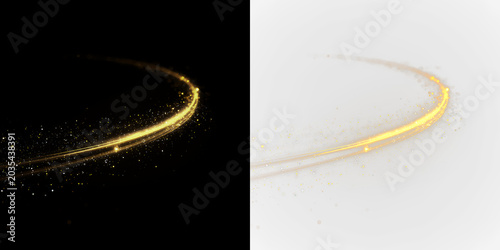 Фотография Swirling golden light with sparkles isolated on transparent and black background