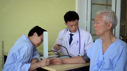 Asian senior couple check up with doctor at hospital longevity care medical trend