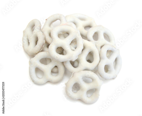 Colorful chocolate covered pretzels on white background