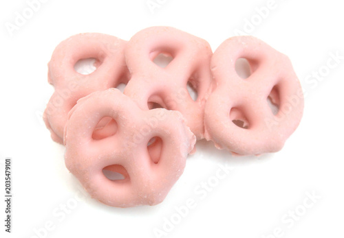 Colorful chocolate covered pretzels on white background