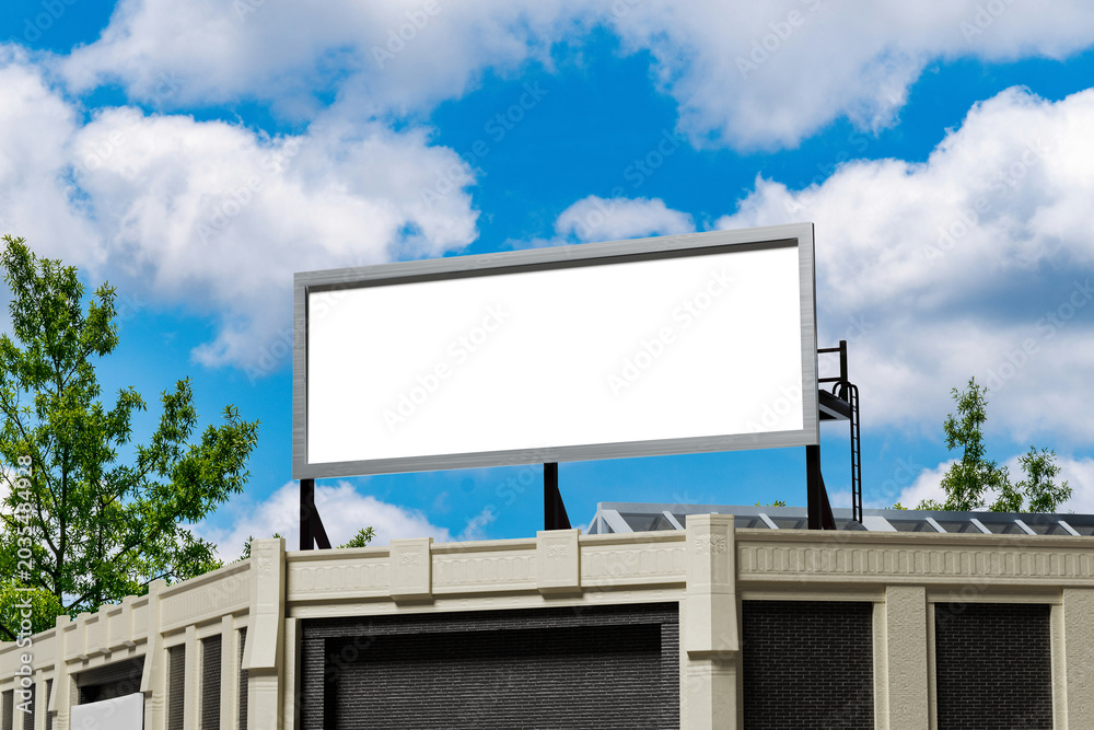 Fototapeta premium Outdoor advertising billboard template with empty white screen against blue sky 