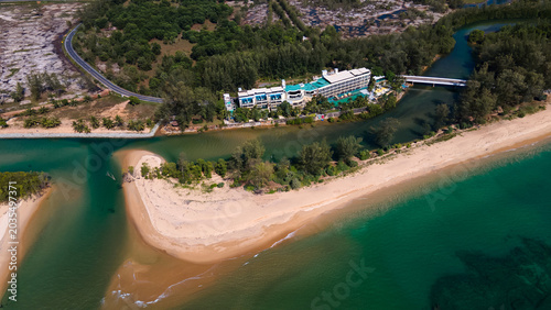 Quadro em tela High altitude drone view of coastal landscape with mountains, sea and fields