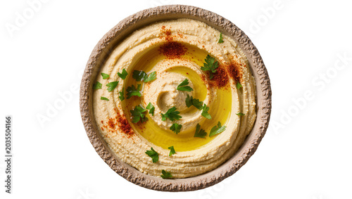 Photos Creamy hummus with olive oil, paprika and parsley garnish in rustic bowl