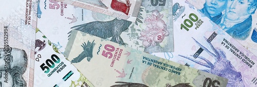 Bilde på lerret Argentine peso money banknotes bunch on table