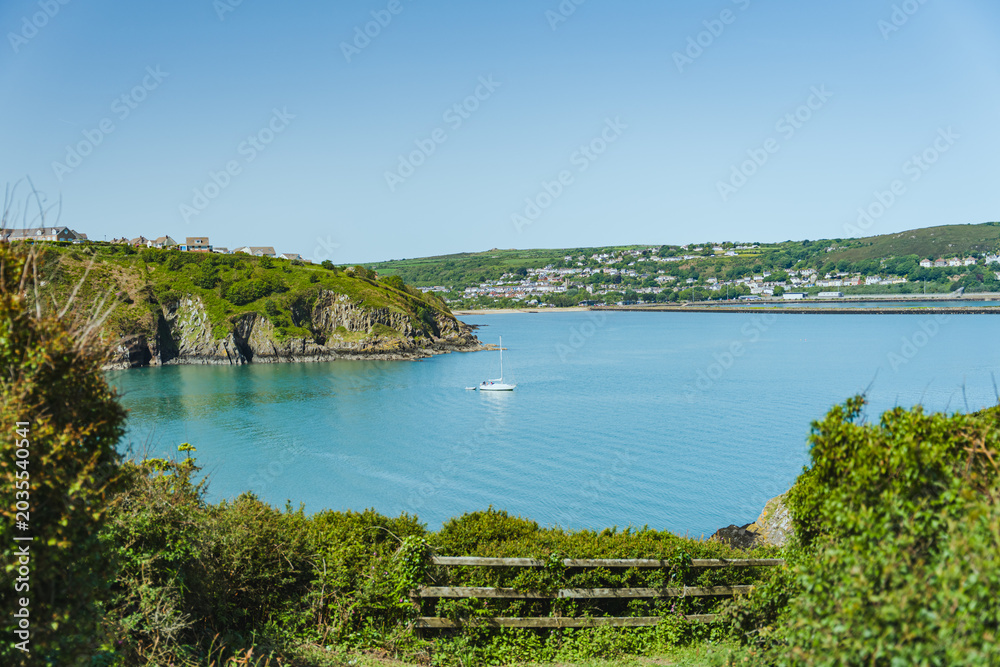 Fototapeta premium Panoramic coastal bay view in Fishguard Lower Town Wales