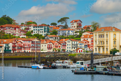 Quadro su tela Traditional half-timbered basque houses in port of Saint Jean de Luz, Nouvelle-A