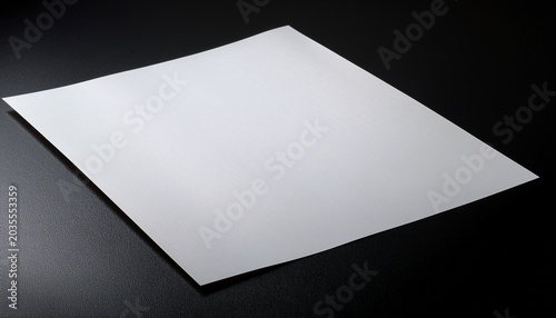 A White A4 Sheet Of Paper On A Black Background