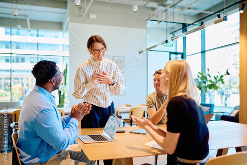 Tableau sur toile Group of diverse business professionals applauding and showing appreciation to a