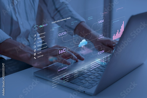 Foto Person interacting with laptop in a dark room with cloud ops control interface