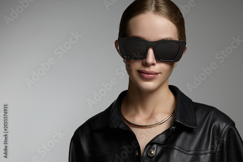 Beautiful young woman in sunglasses