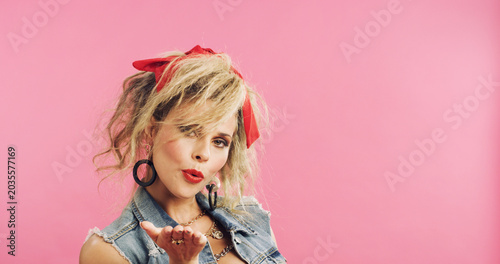 Foto Portrait, retro and flirty woman in studio with fashion, accessories and 80s style