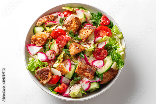 Fresh Lebanese Fattoush Salad on a White Plate with Colorful Ingredients and Crisp Greens