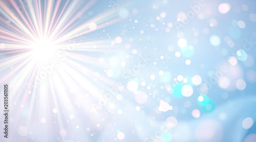 Bright shining sunburst with lens flare and dreamy floating bokeh orbs on an abstract light blue background
