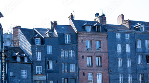 Φωτογραφία Blue-painted half-timbered Norman house with brick and timber facade