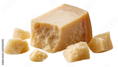 Foto Isolated Parmesan cheese wedge and rough broken chunks showing rich texture, age