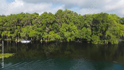 Tranquil Cypress Swamp with Docked Boat