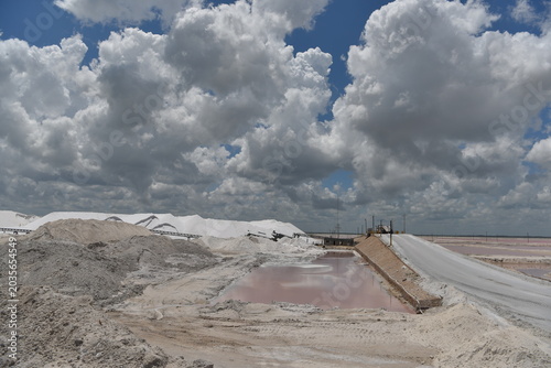 Expansive salt flat landscape under stormy clouds