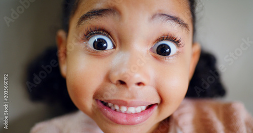 Cuadro en lienzo Surprise, child and portrait of girl in home with excitement, good news or silly reaction to announcement