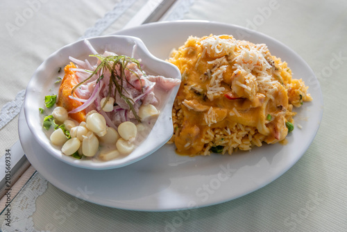 Fotografie Dish in Peru - duo marino - ceviche and arroz con mariscos (rice with seafood)