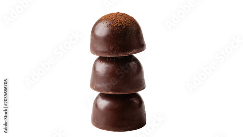 Obraz na plátně Isolated stack of three gourmet dark chocolate truffles dusted with cocoa powder