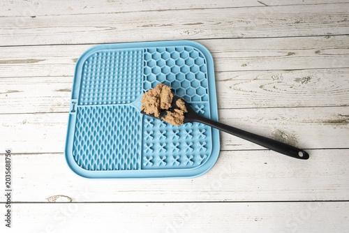 Silicone board for a dog to lick, providing mental stimulation.