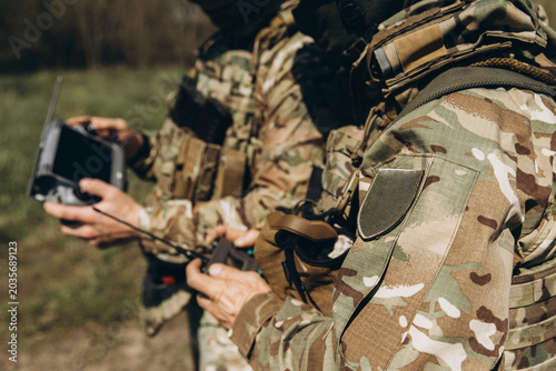 Quadro su tela Ukrainian soldiers operating drone remote control system