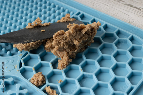 Silicone board for a dog to lick, providing mental stimulation.