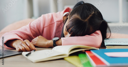 фотографія Books, education and sleeping with girl on desk in home for burnout, cram session or fatigue