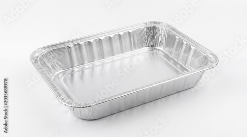 Empty aluminum foil baking pan on white background for cooking and food preparation