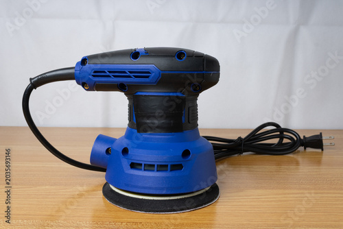 Orbital sander on a flat surface, sander isolated