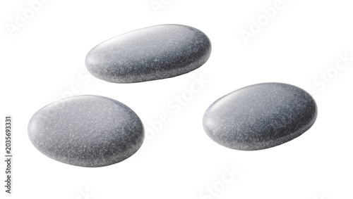 Isolated tranquil set of three smooth, textured grey and subtle purple spa or decorative stones