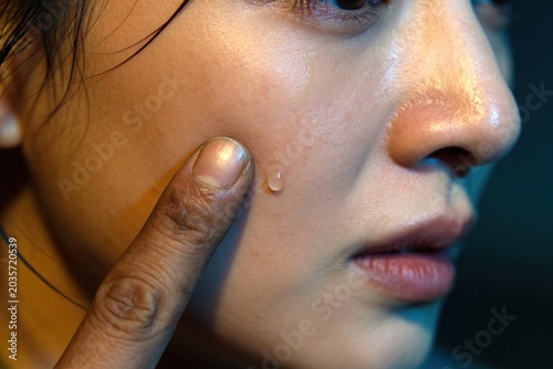 The Wiped Tear, Tender Repair, Close-Up Portrait of Woman Touching Skin with Water Drop Emotion