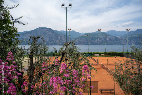 Tennis courts with Lake Garda and mountain panorama