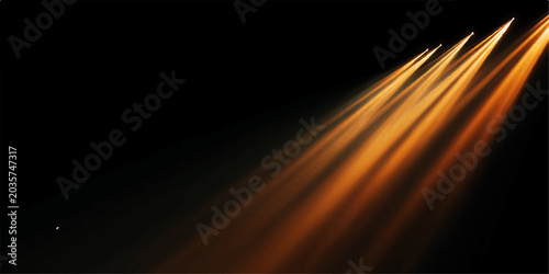 Photos Golden stage lights cut through the darkness, creating a dramatic and ethereal atmosphere with their warm, glowing beams, perfect for setting a mood or highlighting a performance