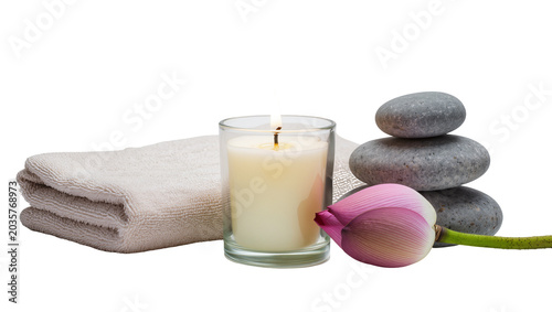 Bild auf Leinwand Isolated tranquil spa arrangement with clean towels, scented candle, zen stones