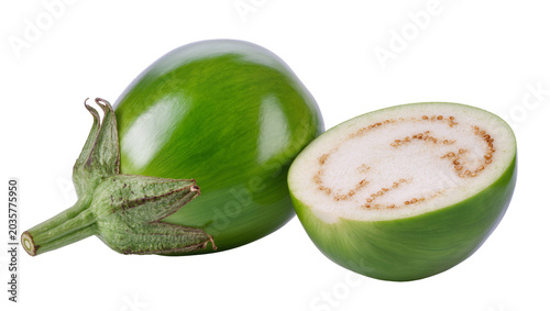 Isolated fresh green Thai eggplants, one whole and one half cut, healthy organic vegetable food