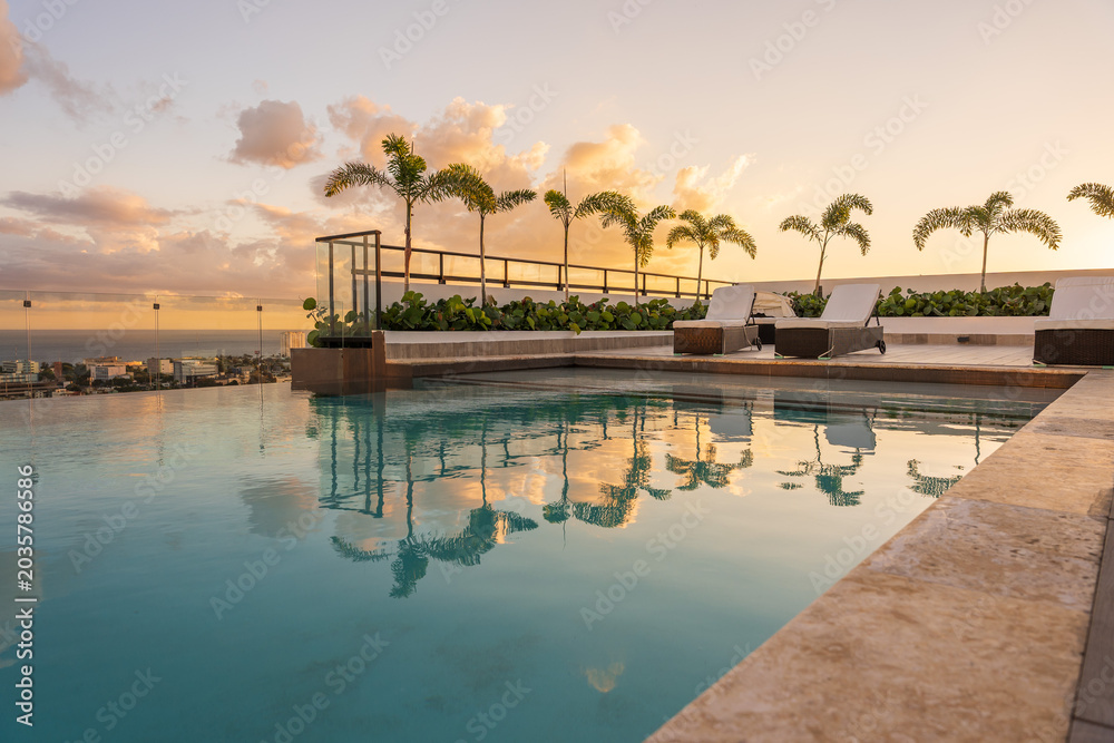 Fototapeta premium Sunset over the pool in the caribbean