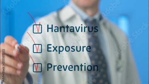 Doctor checking off hantavirus, exposure, and prevention from a visible checklist, indicating medical diagnosis and health awareness against viral infection