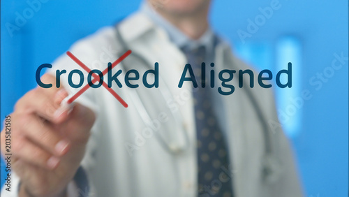 Doctor's hand crossing out crooked and presenting aligned on a screen, symbolizing a medical professional's focus on correction, health, and proper alignment in healthcare treatment and well being