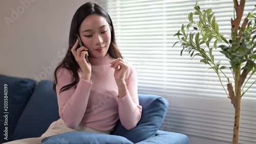 Happy woman making a phone call