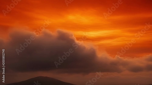 Fiery Sunset Sky, Dramatic Orange Clouds, Moody Atmosphere, Evening Horizon