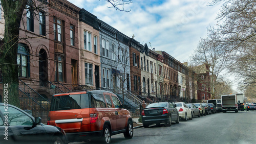 New York, US, 15 January 2015 Row Houses and Parked Cars Along an Urban Residential Street