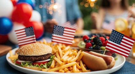 Outdoor fourth of july feast featuring a gourmet burger, crispy fries, and fresh berries