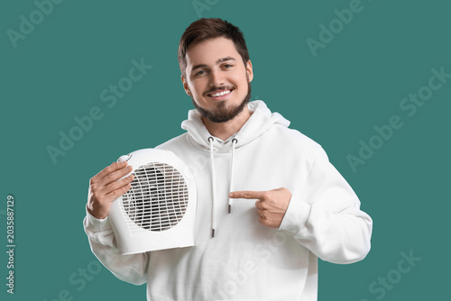 Young man pointing at elect...