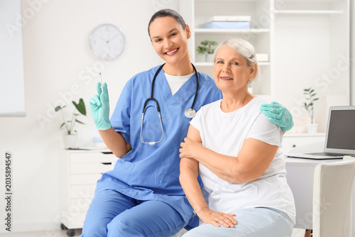 Female doctor with senior w...