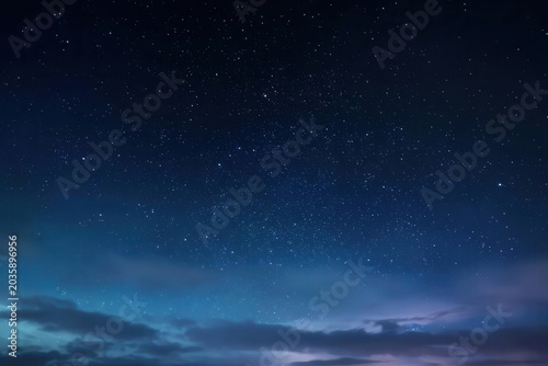 Stunning Night Sky with Stars and Clouds Background