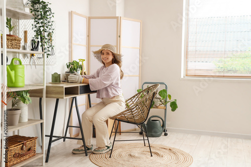 Female gardener with plant ...