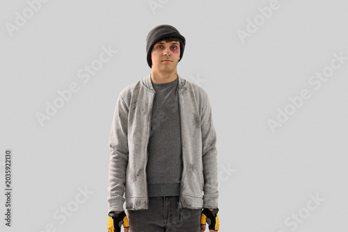 Foto Young homeless man on light background